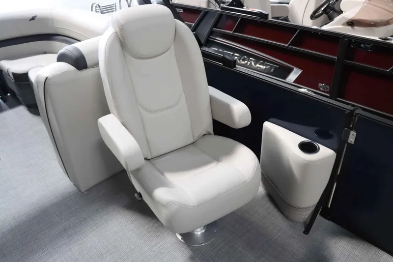 Slide: The Image of Luxurious seating in 2025 Starcraft EXS 3 boat interior, featuring plush white upholstery. - 14