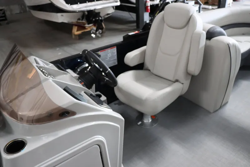 Slide: The Image of 2025 Starcraft EXS 3 boat interior with steering console and comfortable seating. - 15