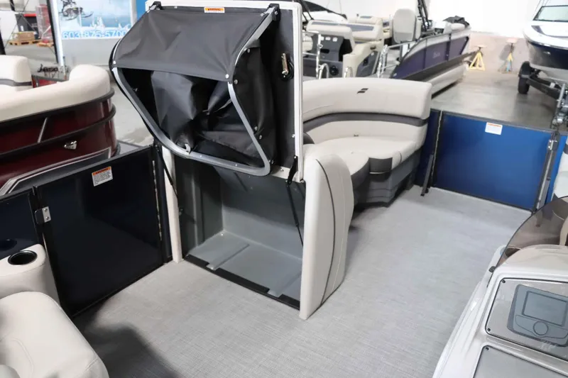 Slide: The Image of 2025 Starcraft EXS 3 boat interior with seating and storage area. - 20