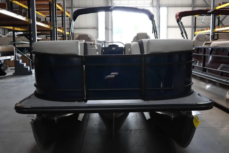 Slide: The Image of 2025 Starcraft EXS 3 pontoon boat in warehouse, front view. - 7