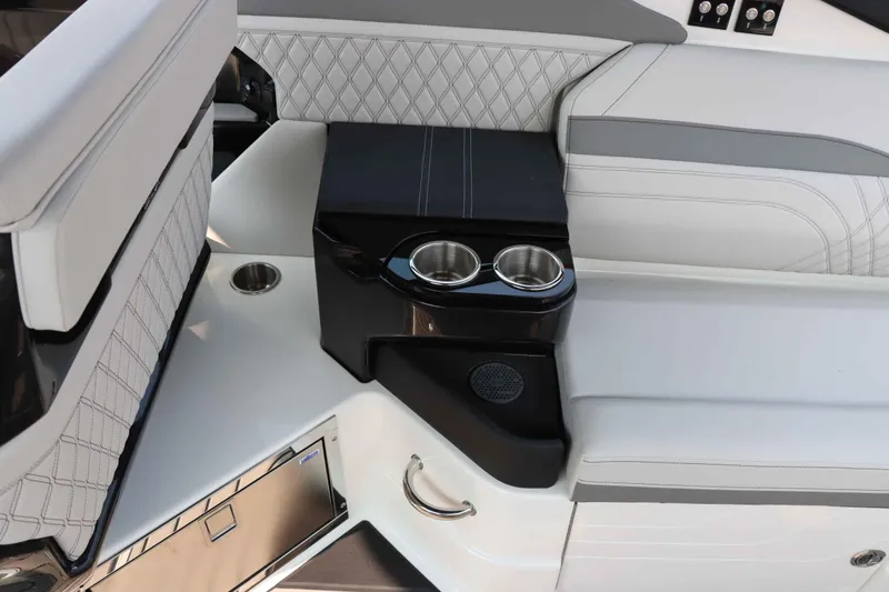 Slide: The Image of 2024 Sea Ray 280SLX interior with luxurious seating and cup holders. - 17