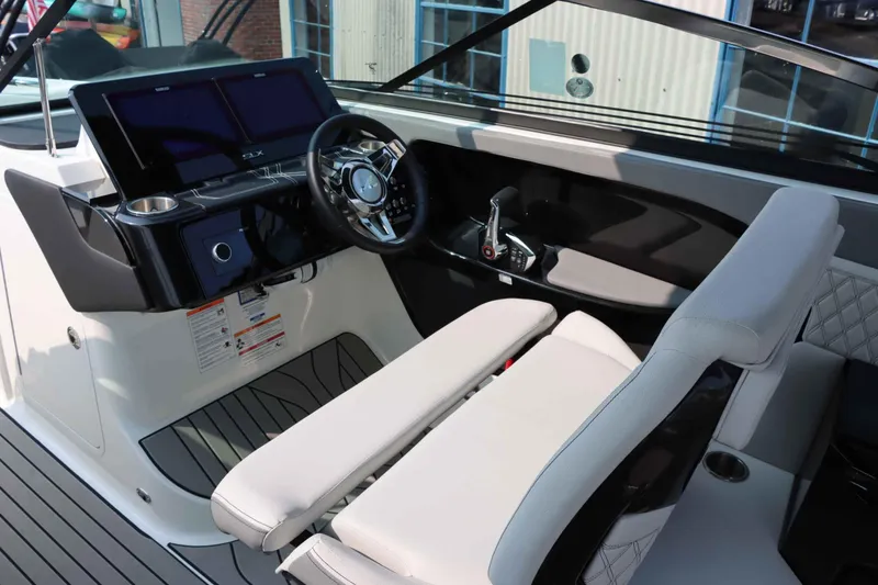 Slide: The Image of 2024 Sea Ray 280SLX boat interior with modern dashboard and steering wheel. - 19
