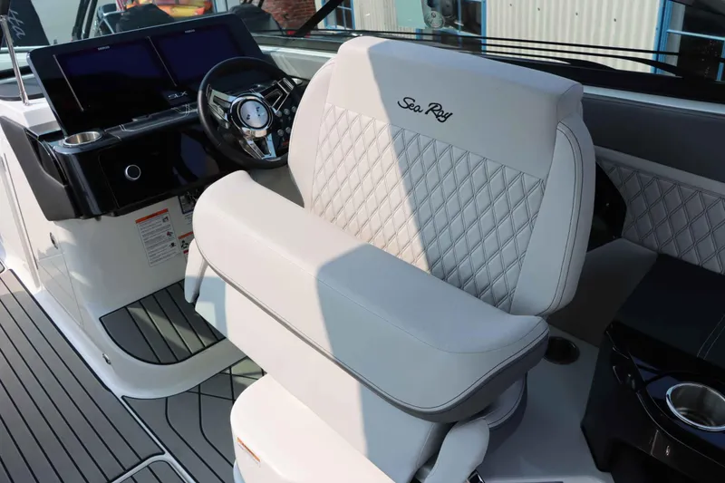 Slide: The Image of 2024 Sea Ray 280SLX boat interior with luxury seating and modern dashboard. - 20