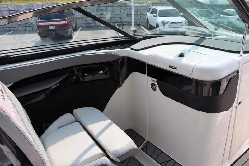 Slide: The Image of Interior of 2024 Sea Ray 280SLX boat, featuring sleek white seating and modern design. - 22