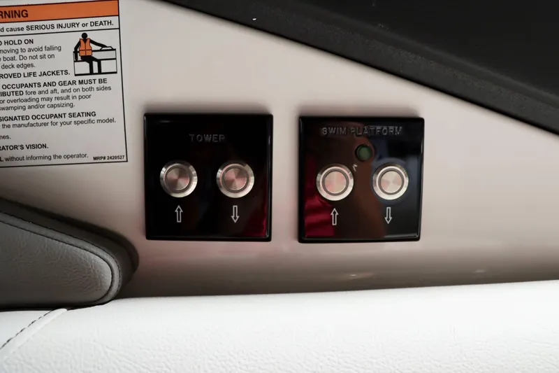 Slide: The Image of Control buttons for tower and swim platform on 2024 Sea Ray 280SLX boat. - 23