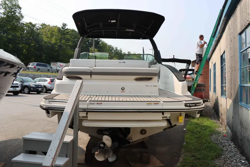 Slide: The Image of 2024 Sea Ray 280SLX boat displayed outdoors, rear view with swim platform. - 4