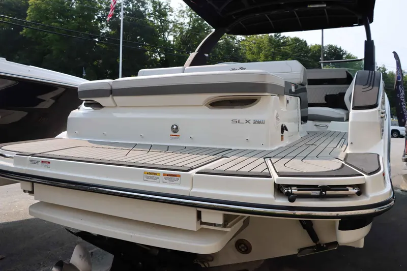 Slide: The Image of 2024 Sea Ray 280SLX boat with spacious deck and seating area. - 8