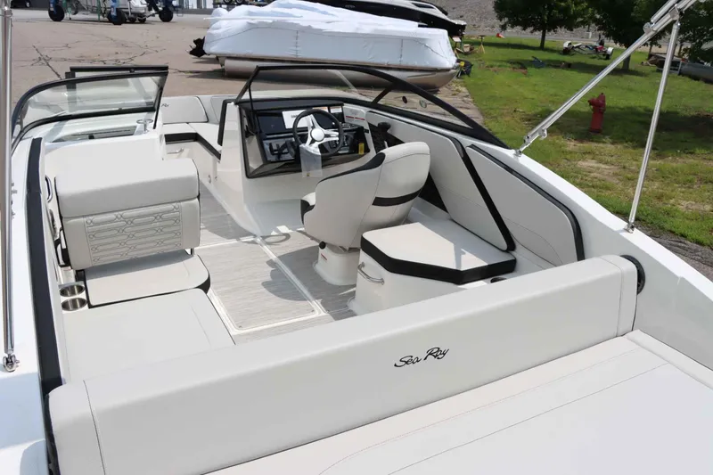 Slide: The Image of 2025 Sea Ray 210SPX boat interior with sleek seating and modern design. - 10
