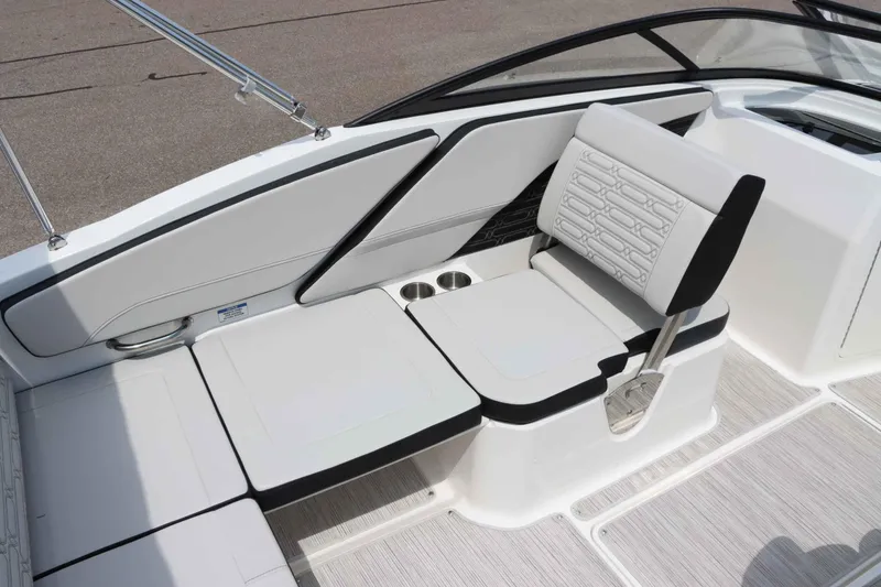 Slide: The Image of 2025 Sea Ray 210SPX boat interior with sleek white seating and modern design. - 14