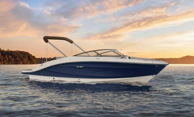 Slide: The Image of 2025 Sea Ray 210SPX boat on water at sunset. - 23