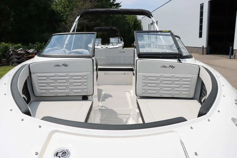 Slide: The Image of 2025 Sea Ray 210SPX boat interior with white seating and open deck. - 7