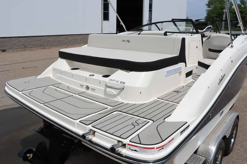 Slide: The Image of 2025 Sea Ray 210SPX boat with sleek design and spacious deck. - 8