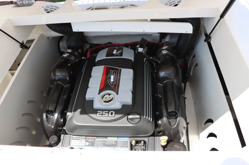 Slide: The Image of 2024 Sea Ray 230SPX boat engine compartment with Mercury 4.5L 250 HP engine. - 19