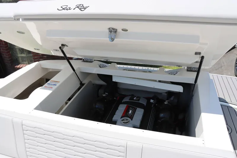 Slide: The Image of 2024 Sea Ray 230SPX boat engine compartment with open hatch. - 20