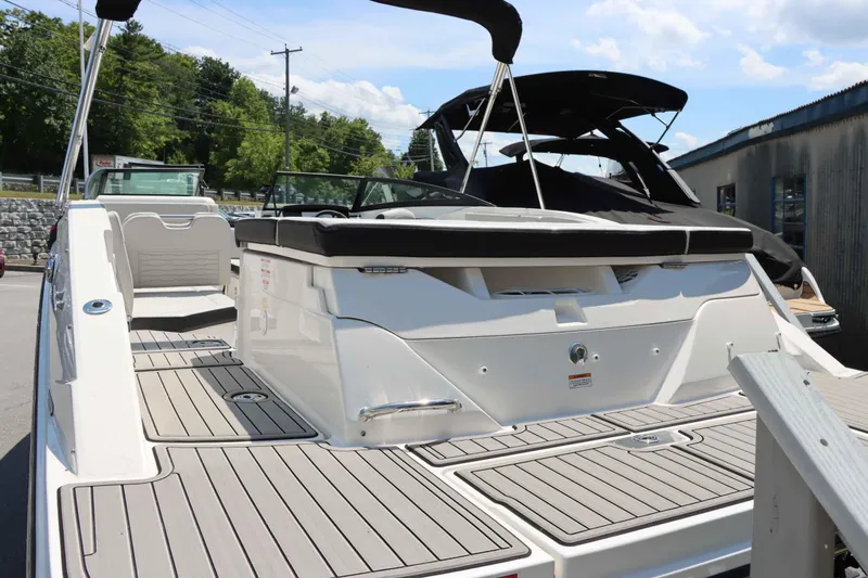 Slide: The Image of 2024 Sea Ray 230SPX boat with spacious deck and modern design. - 7