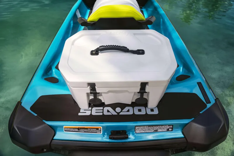 Slide: The Image of 2024 Sea-Doo GTI SE 130 SS with storage box on turquoise water. - 3