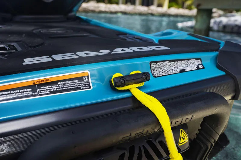 Slide: The Image of 2024 Sea-Doo GTI SE 130 SS with safety warnings and yellow rope detail. - 5