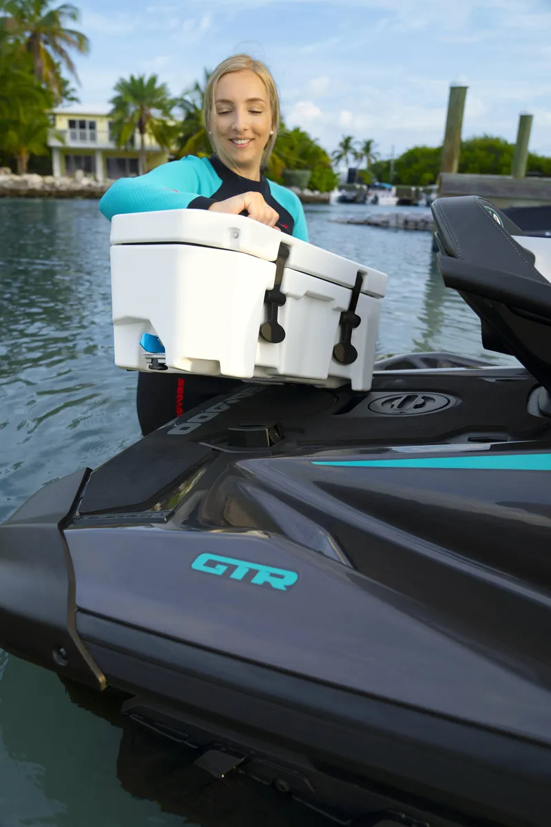 Slide: The Image of Woman loading cooler onto 2024 Sea-Doo GTR 230 SS jet ski. - 6