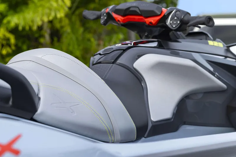 Slide: The Image of 2024 Sea-Doo RXT-X 325 SS jet ski seat and handlebars close-up. - 4