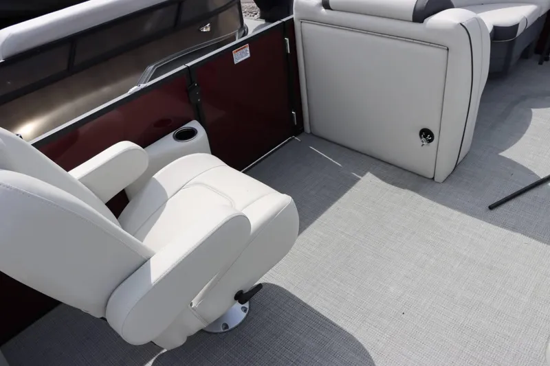 Slide: The Image of Interior seating of 2024 Starcraft EXS 3 pontoon boat with white upholstery. - 11