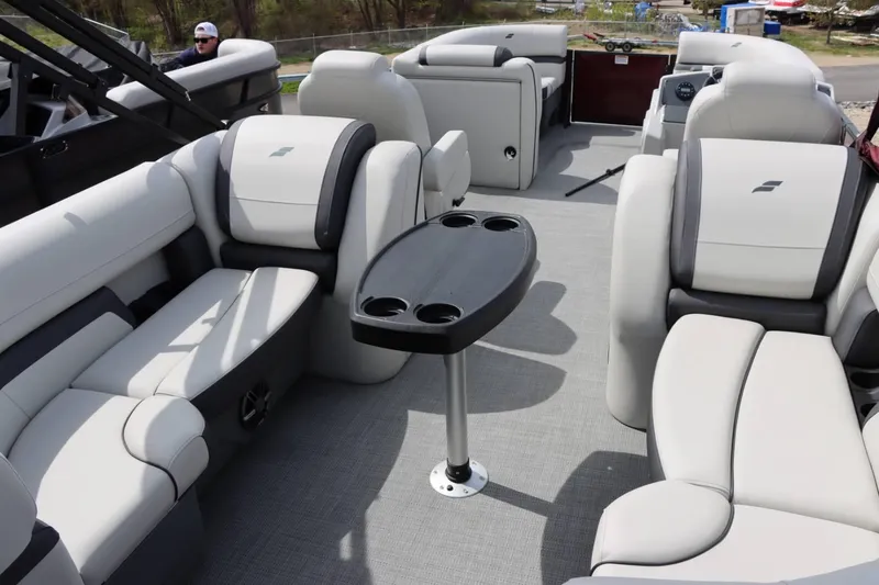 Slide: The Image of 2024 Starcraft EXS 3 boat interior with luxurious seating and a central table. - 12