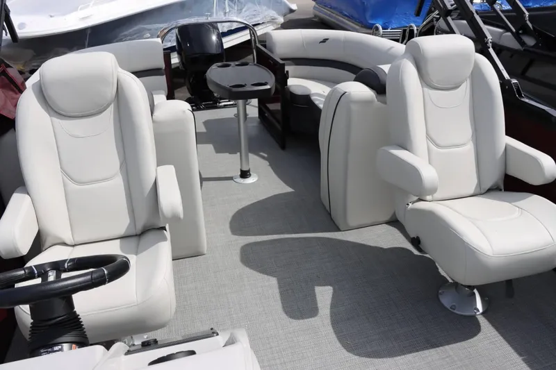 Slide: The Image of 2024 Starcraft EXS 3 boat interior with white leather seats and a central table. - 15