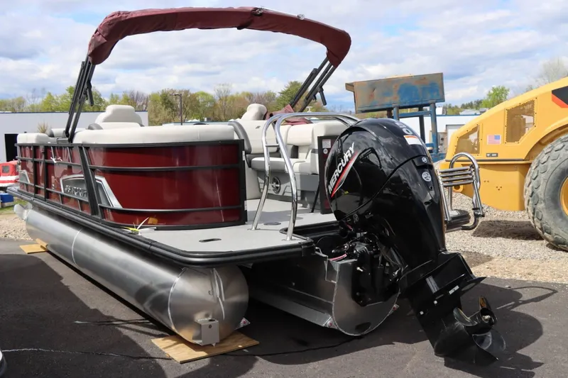 Slide: The Image of 2024 Starcraft EXS 3 pontoon boat with Mercury outboard motor. - 3