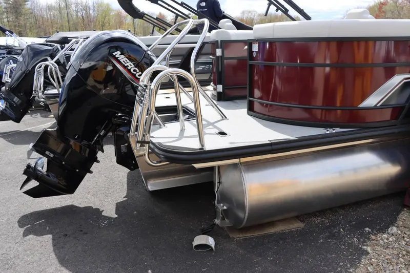 Slide: The Image of 2024 Starcraft EXS 3 pontoon boat with Mercury outboard motor. - 5