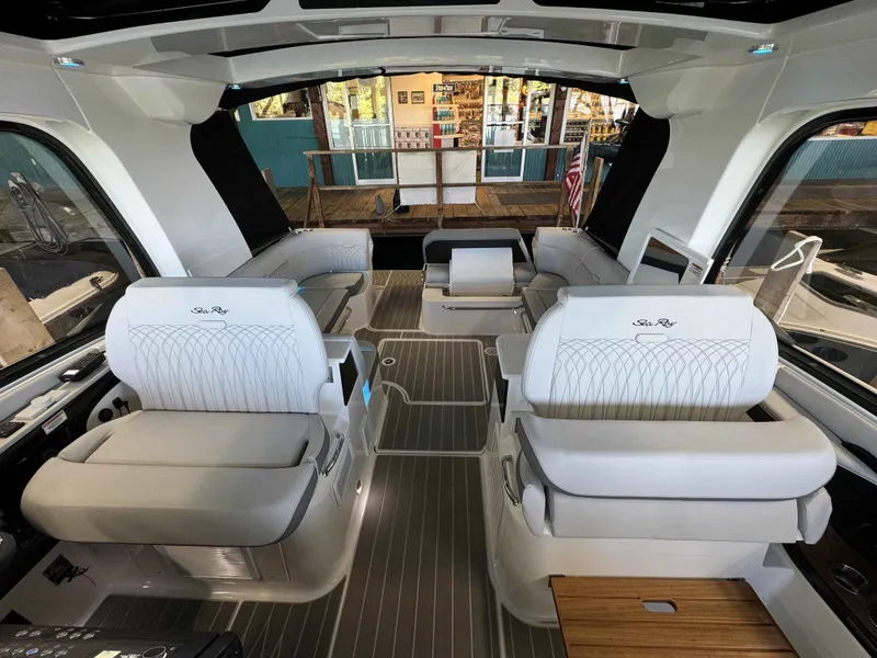 Slide: The Image of Luxurious interior of 2024 Sea Ray 370 Sundancer yacht with elegant seating and modern design. - 6