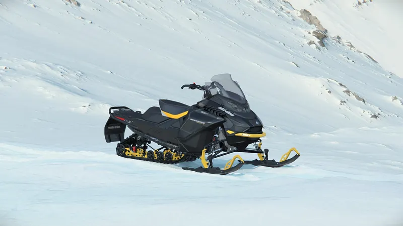 Slide: The Image of 2024 SKI DOO RENEGADE ADR ENDURO 900 ACE TURBO R snowmobile on snowy mountain terrain. - 9