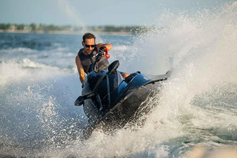 Slide: The Image of Man riding 2024 Waverunner GP SVHO A jet ski on ocean waves. - 5