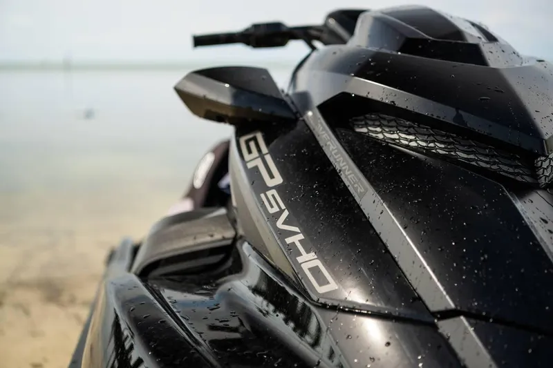 Slide: The Image of 2024 Waverunner GP SVHO A jet ski with water droplets on sleek black surface. - 6