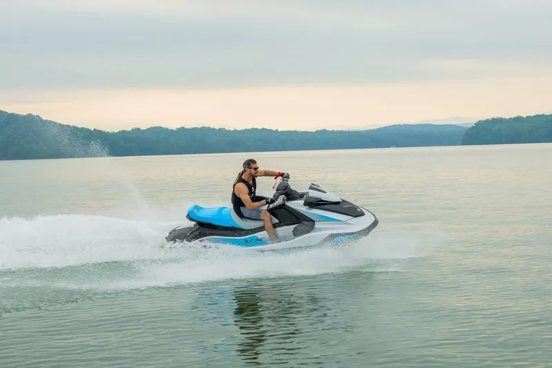 Slide: The Image of 2024 Waverunner VX Cruiser A jet ski on a serene lake. - 6