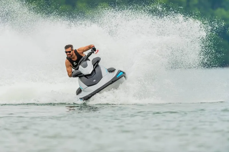 Slide: The Image of Man riding 2024 Waverunner VX CRUISER A jet ski on a lake. - 7