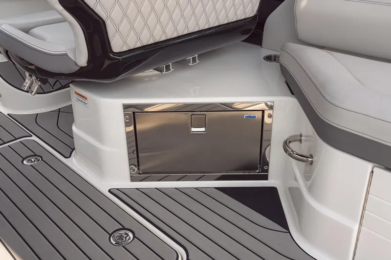 Slide: The Image of 2024 Sea Ray 280SLX boat interior with stainless steel storage compartment. - 11