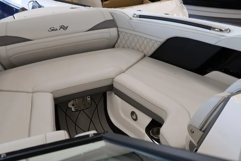 Slide: The Image of 2024 Sea Ray 280SLX boat interior with luxurious white seating. - 13