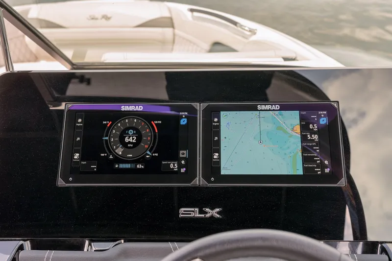 Slide: The Image of 2024 Sea Ray 280SLX dashboard with dual Simrad displays showing navigation and engine data. - 16