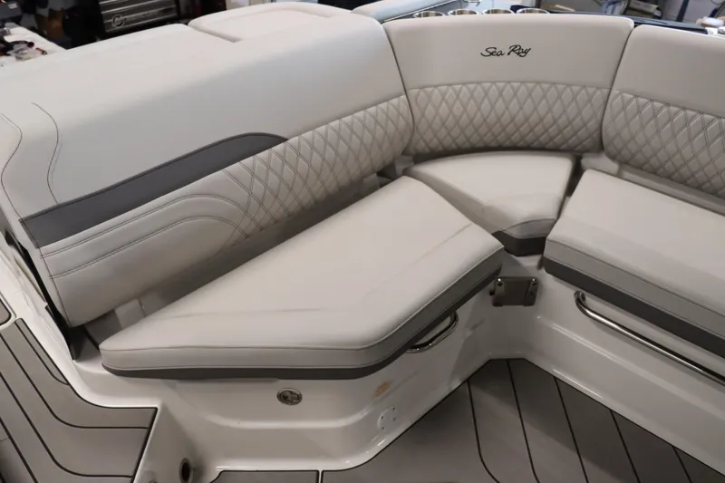 Slide: The Image of 2024 Sea Ray 280SLX boat interior with luxurious white and gray seating. - 6