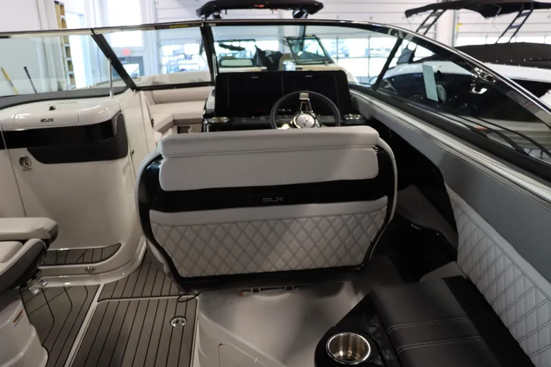 Slide: The Image of Interior of 2024 Sea Ray 280SLX boat with modern seating and steering console. - 8