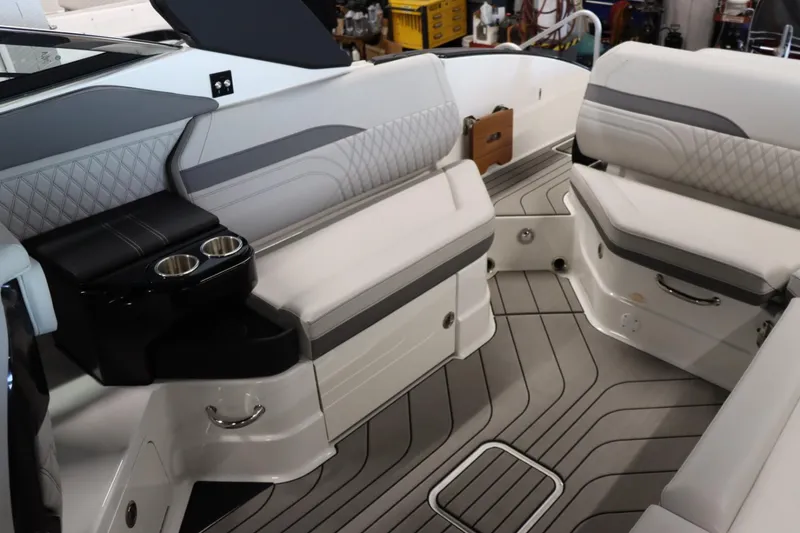 Slide: The Image of Interior seating of 2024 Sea Ray 280SLX boat with cup holders and modern design. - 9