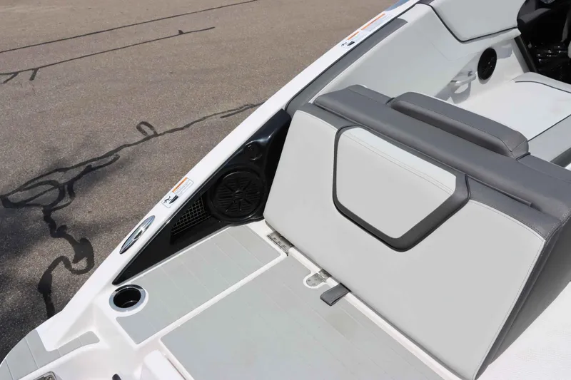 Slide: The Image of 2024 Yamaha AR250 boat interior with sleek seating and speaker system. - 13