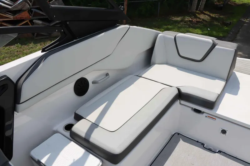 Slide: The Image of 2024 Yamaha Boats AR250 interior seating with modern design and comfortable upholstery. - 14