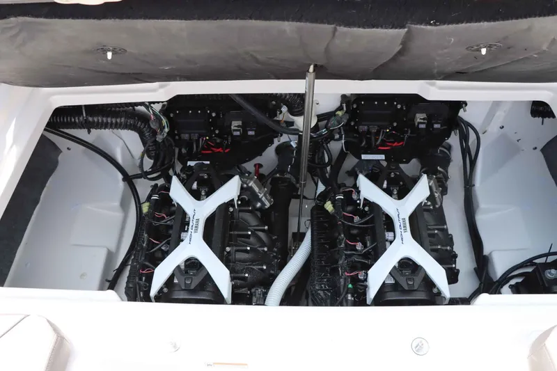 Slide: The Image of 2024 Yamaha AR250 boat engine compartment with dual engines. - 16