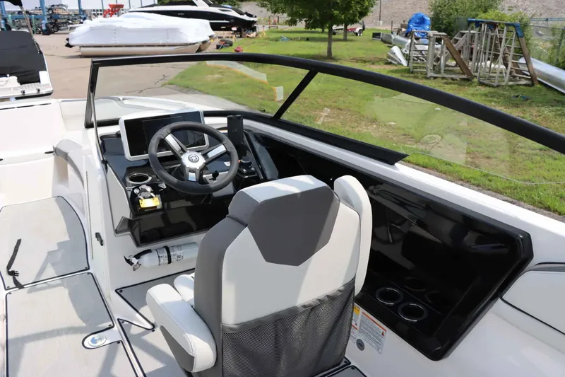 Slide: The Image of 2024 Yamaha Boats AR250 cockpit with steering wheel and modern dashboard controls. - 17