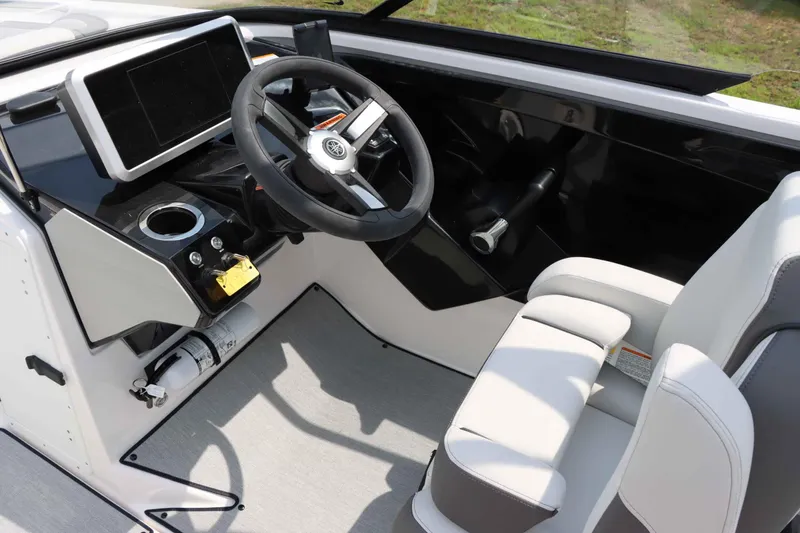 Slide: The Image of 2024 Yamaha AR250 boat cockpit with steering wheel and modern dashboard. - 20