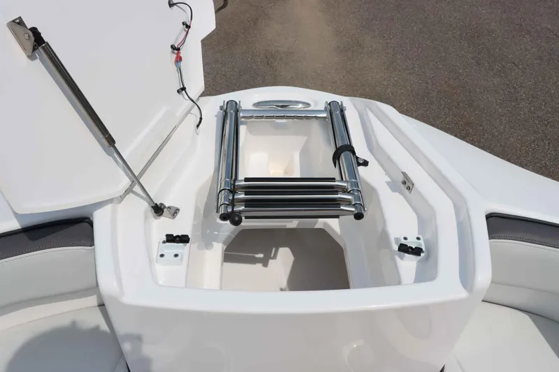 Slide: The Image of 2024 Yamaha AR250 boat with open storage compartment and ladder. - 27
