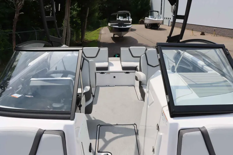 Slide: The Image of 2024 Yamaha Boats AR250 interior with seating and windshield view. - 28
