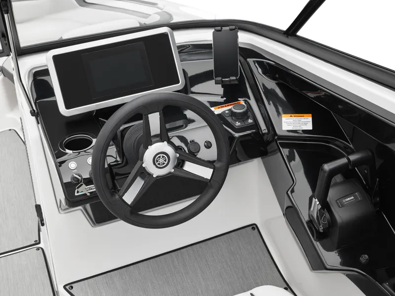 Slide: The Image of 2024 Yamaha Boats AR250 dashboard with steering wheel, touchscreen, and control panel. - 37