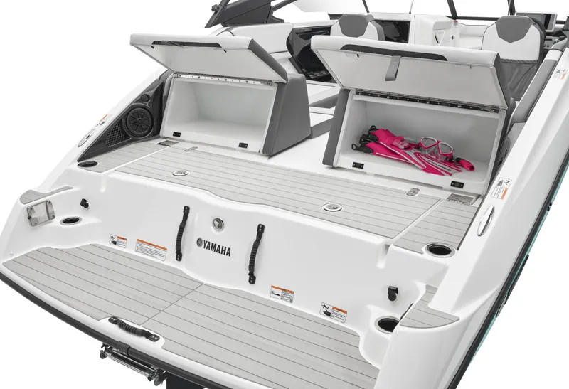 Slide: The Image of 2024 Yamaha Boats AR250 with open storage compartments and swim platform. - 38