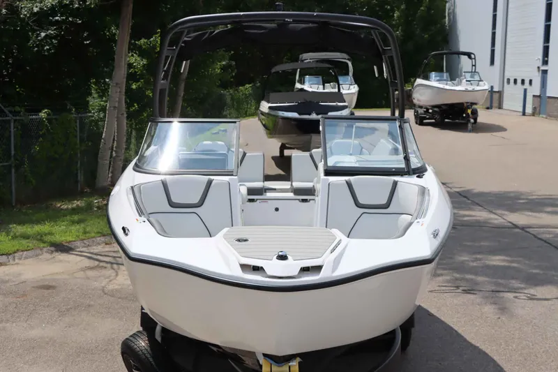 Slide: The Image of 2024 Yamaha Boats AR250, sleek white design, parked outdoors. - 4